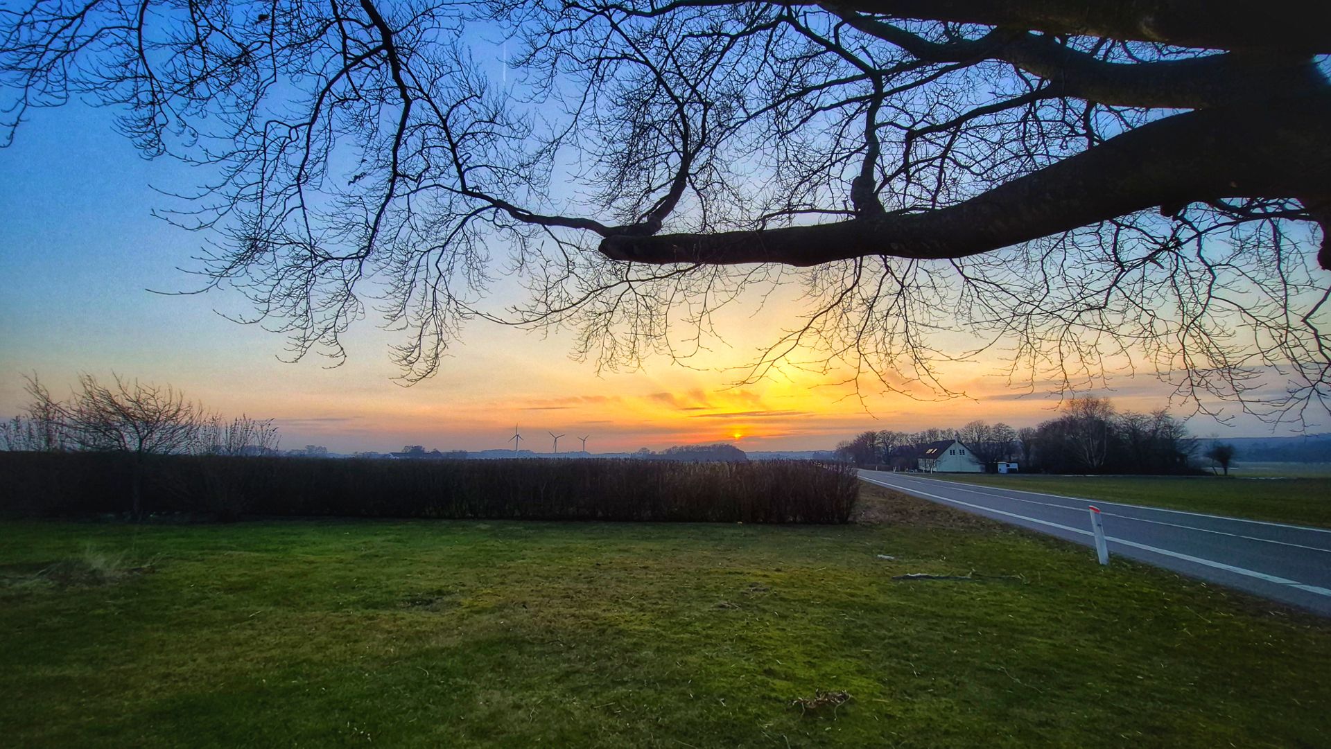 
          As March arrives the sunsets are accompanied by green grass, finally free from it's cover of snow.
        